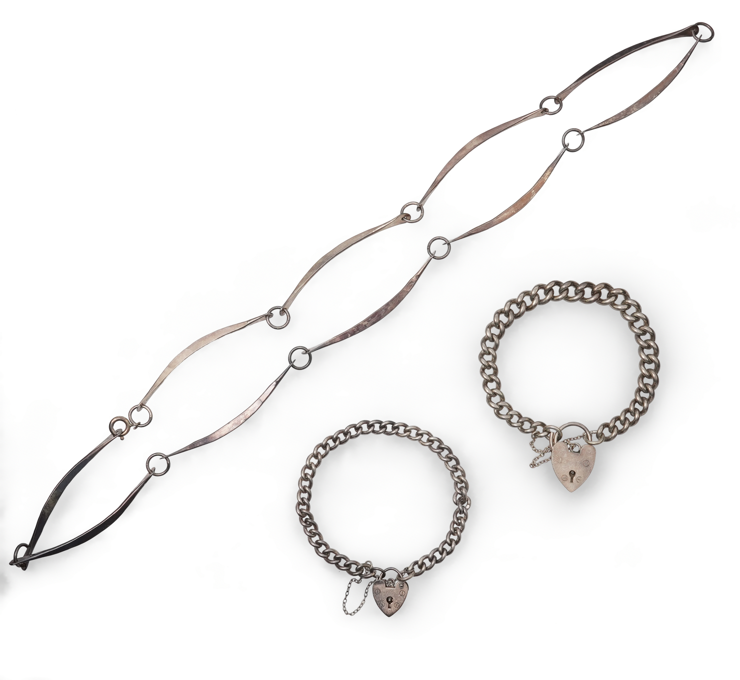 A 1960'sGeorg Jensen silver tie clip, design no. 63, 53mm, together with a stylish sterling necklace and two silver curb link bracelets.